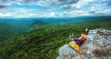 woman asians travel relax in the holiday. View mountain nature on the cliffs. photo