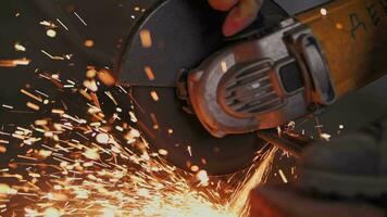 Metal is cut with a grinder, sparks fly. video