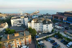 Beautiful Aerial Footage of British Tourist Attraction at Sea View of Bournemouth City of England Great Britain UK. High Angle Image Captured with Drone's Camera on September 9th, 2023 During Sunset photo