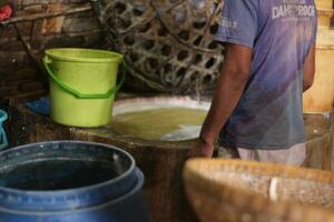 Magelang, Indonesia.09 18 2023-tofu factory employees are starting activities to make typical Indonesian tofu. photo