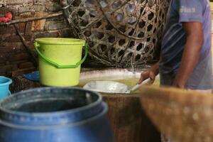 Magelang, Indonesia.09 18 2023-tofu factory employees are starting activities to make typical Indonesian tofu. photo