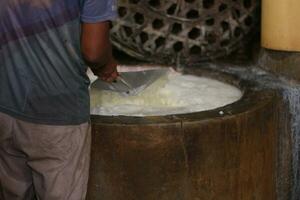 Magelang, Indonesia.09 18 2023-tofu factory employees are starting activities to make typical Indonesian tofu. photo