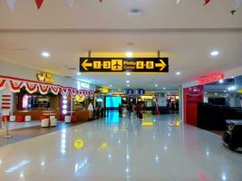 Kuta, Badung, Bali, Indonesia - August 25 2023 - View of the hallway leading to the aircraft departure gate at I Gusti Ngurah Rai International Airport in the morning photo