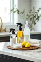 Specialized cleaning agents and tools for kitchen appliances on a marble countertop photo