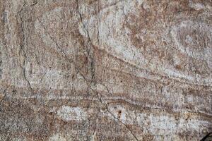 Mountain rock texture. Natural brown slate granite slab marble stone ceramic seamless tile rough surface background. Architecture grunge modern abstract style element. Close-up, copy space photo