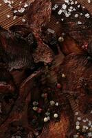 Vertical Shot of Dried Peppered Beef Jerky photo