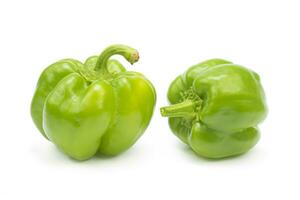 Two bell peppers Capsicum annuum grossum isolated on white background photo