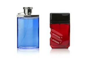 Red and blue perfume bottles on isolated white background photo