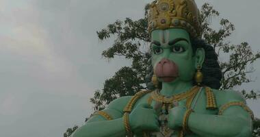 Seen head with hands of statue of Hanuman at Batu Caves, Malaysia video