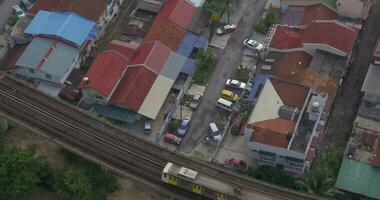 Buildings and railway with a passing train in city of Kuala Lumpur, Malaysia video