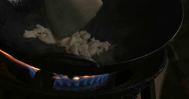 Making noodles dish in wok on gas fire, Thailand video