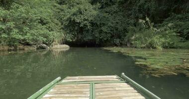 Boat sailing to the dark islet cave Trang An, Vietnam video