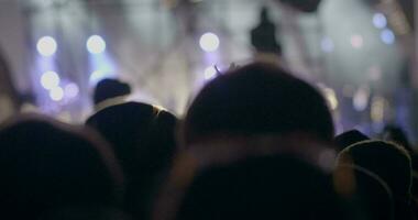 Applauding audience against stage lights video