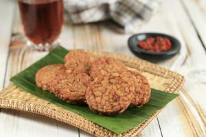 Round Tempeh Goreng or Fried Tempe Served with Sambal photo