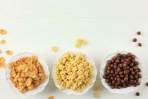 Top View Three Various Cereal Breakfast on White Bowl photo