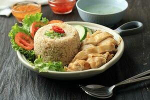 Hainan Chicken Rice with Chicken Stock Soup, Garlic Oil, and Spicy Sambal photo