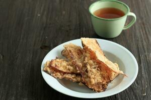 Sale Pisang Goreng, Fried Crunchy Sliced Dried Banana with Flour Coating. photo