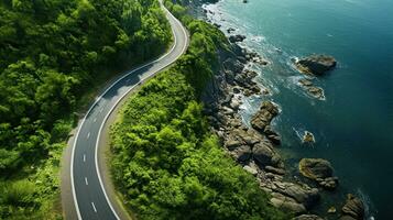 generativo ai, aéreo ver de curvo asfalto la carretera cerca el Oceano o mar, línea costera foto