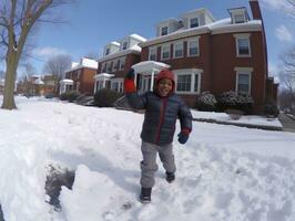 kid enjoys the winter snowy day in playful pose AI Generative photo