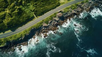 generativo ai, aéreo ver de curvo asfalto la carretera cerca el Oceano o mar, línea costera foto