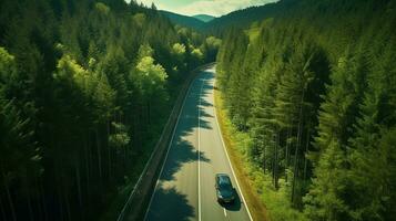 generativo ai, aéreo ver de la carretera Entre verde bosque, verde paisaje foto