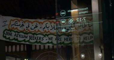 Inviting banner for refugees in Copenhagen Central Station video