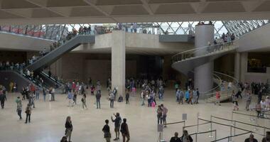 People in the lobby of Louvre Museum video