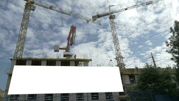 Building under construction with blank banner video