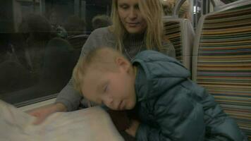 Mother and sleepy child in underground train video