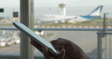 Woman texting on mobile at the airport video