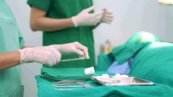 Asian Professional surgeons team performing surgery in the operating room, surgeon, Assistants, and Nurses Performing Surgery on a Patient, health care cancer and disease treatment concept video