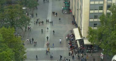 People walking on city street, high angle video