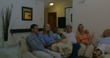 Family spending leisure with TV video