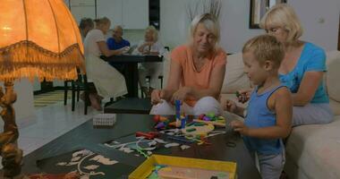 Grandmothers playing with grandson at home video