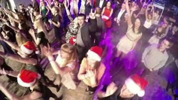 Happy people on New Year party in the club, aerial view video