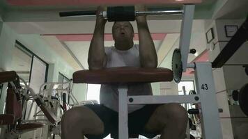 Senior man doing exercise on training machine in gym video