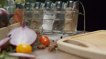 Composition of fresh whole and sliced vegetables on the table. Slow motion video