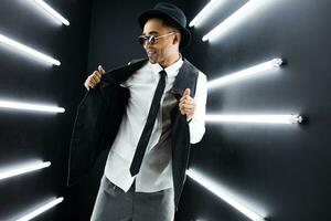 black man dancing in neon lights photo