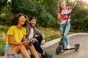 happy young company of friends having fun in park photo