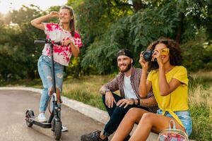 happy young company of friends having fun in park photo