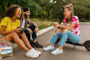 happy young company of friends having fun in park photo