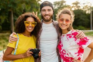 happy young company of friends having fun in park photo