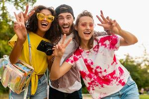 happy young company of friends having fun in park photo