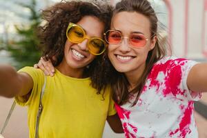 happy young girls friends smiling in street photo