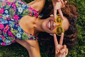 young stylish black woman having fun in park summer fashion style photo