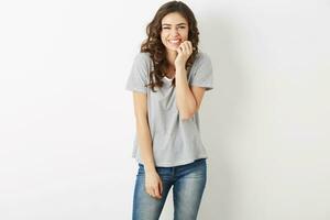 beautiful young woman laughing happy, candid smile, positive face expression, cheerful emotion, teenage hipster style, exited, dressed in jeans , t-shirt, isolated on white background, modern fashion photo
