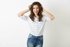 pretty young woman laughing happy, hipster style, dressed in jeans, shirt, isolated on white background, curly hair photo