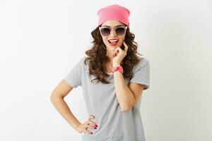 close up portrait of hipster pretty woman in pink hat, sunglasses, smiling, happy mood, isolated, modern youth, fashion trend accessories photo