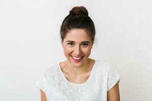 close-up portrait young pretty woman smiling in white t-shirt on white background, happy, positive mood, isolated, sincere smile photo