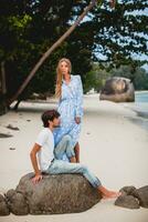 young stylish hipster couple in love on tropical beach photo